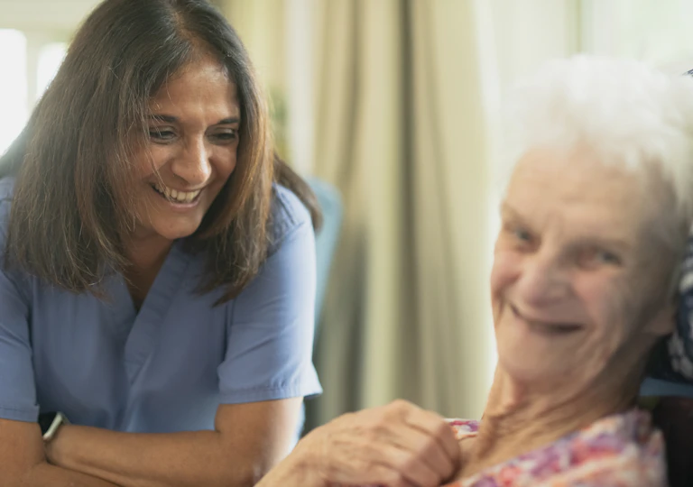 Nurse caring for an elderly patient in senior long-term care