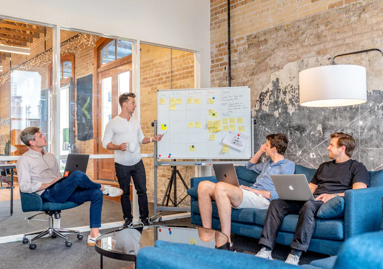 Healthcare marketing strategy session at a whiteboard