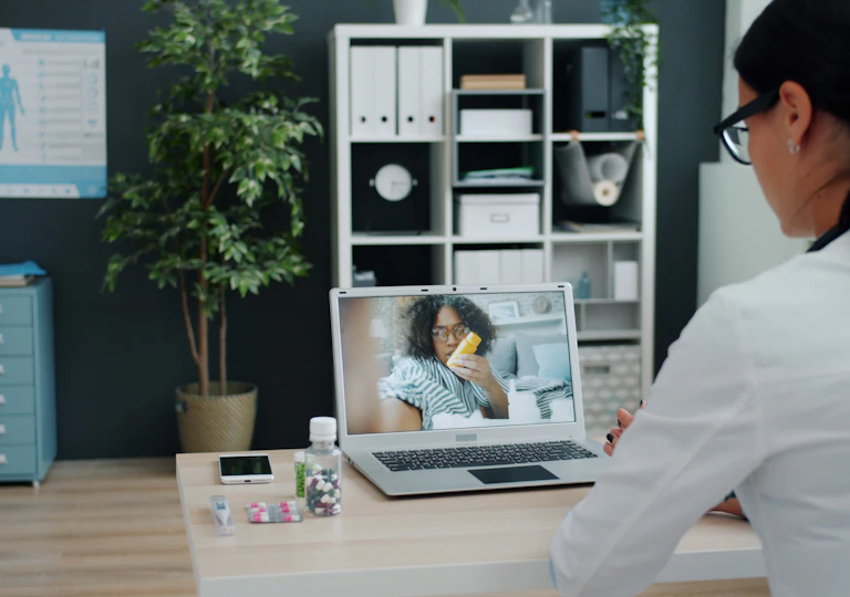 Doctor consulting a patient via a telehealth video call